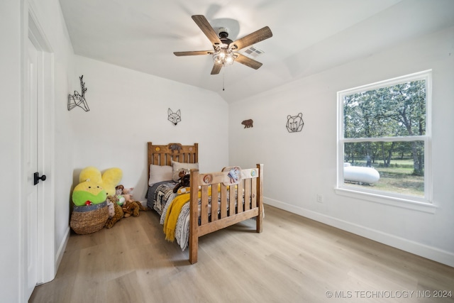 bedroom with ceiling fan and light hardwood / wood-style floors