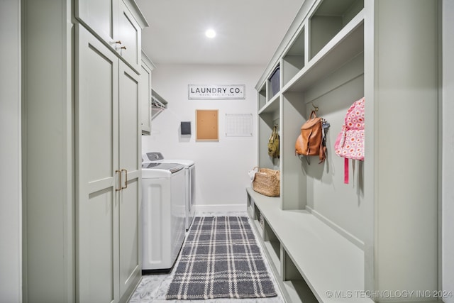 mudroom with washer and clothes dryer