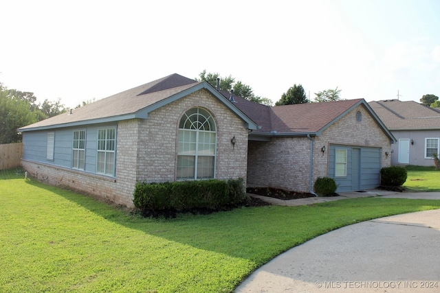 ranch-style house with a front lawn