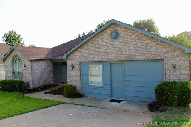 ranch-style house featuring a garage