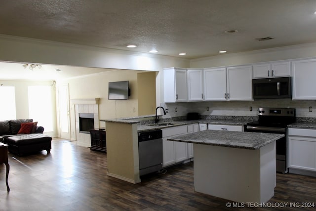 kitchen with white cabinetry, stainless steel appliances, dark hardwood / wood-style flooring, and sink