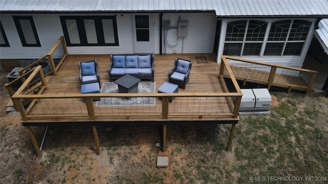 wooden deck featuring an outdoor hangout area