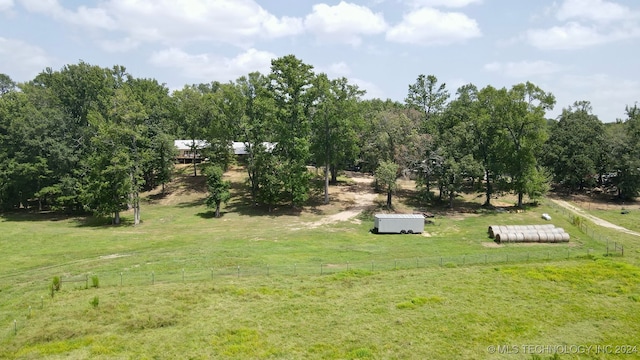 view of yard with a rural view