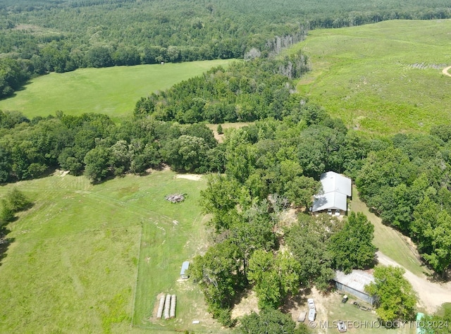 birds eye view of property with a rural view