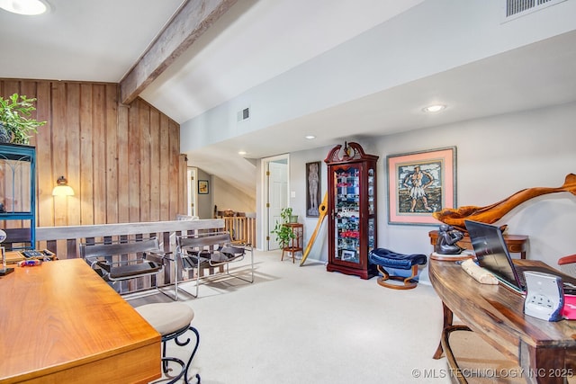 playroom featuring wooden walls, lofted ceiling with beams, and carpet