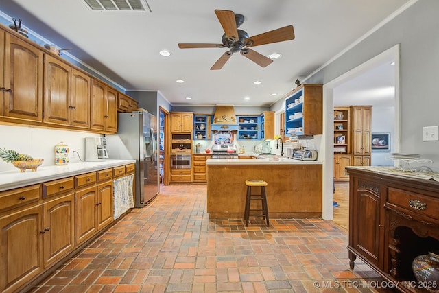 kitchen with premium range hood, open shelves, appliances with stainless steel finishes, and brick floor