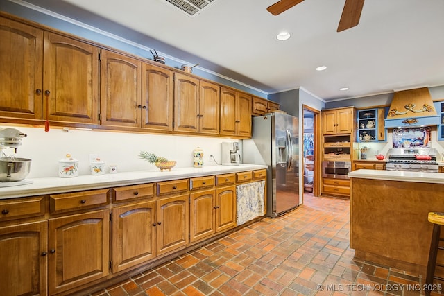 kitchen featuring premium range hood, appliances with stainless steel finishes, ornamental molding, and ceiling fan