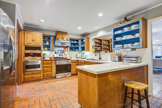 kitchen featuring sink, a breakfast bar area, custom exhaust hood, kitchen peninsula, and stainless steel appliances