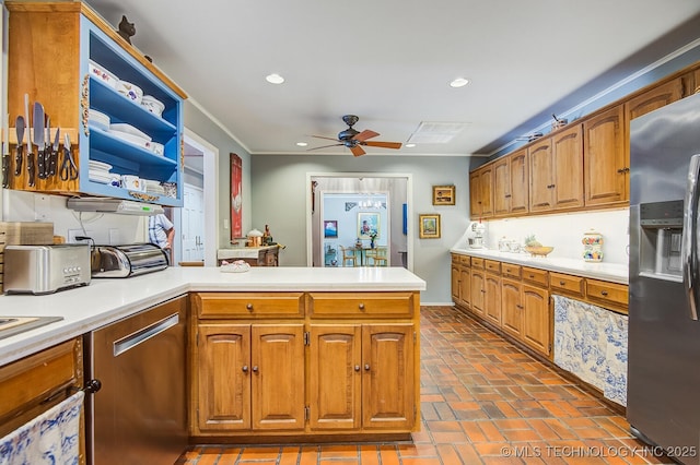 kitchen featuring ceiling fan, appliances with stainless steel finishes, and kitchen peninsula