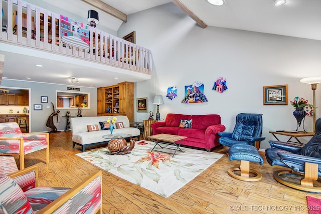 living area with recessed lighting, beam ceiling, high vaulted ceiling, and wood finished floors