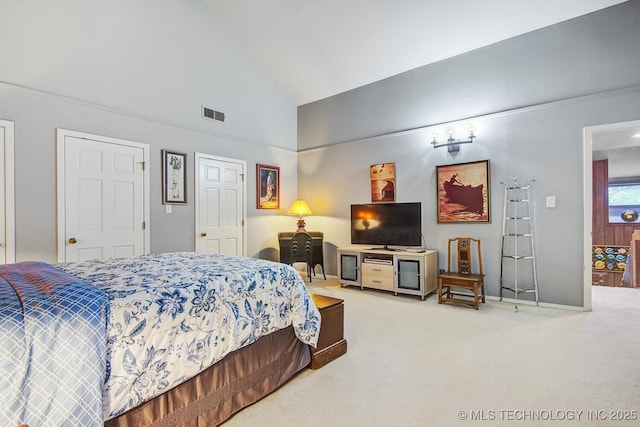 carpeted bedroom featuring visible vents, baseboards, and high vaulted ceiling