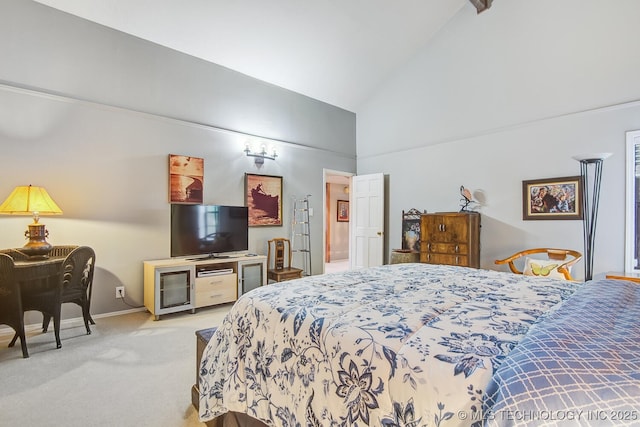 carpeted bedroom featuring high vaulted ceiling