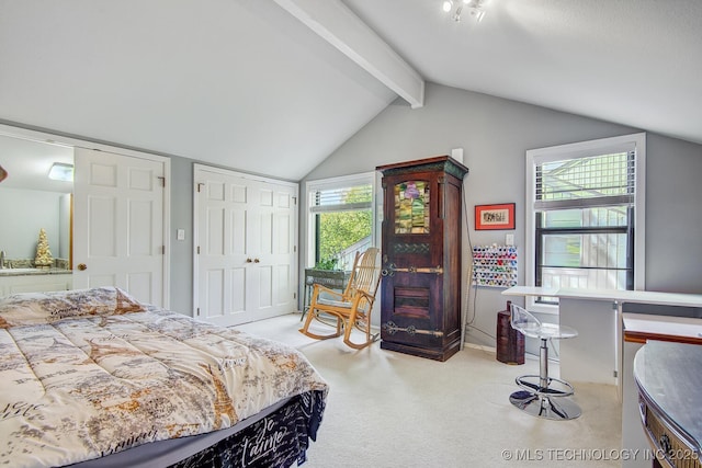 bedroom with light colored carpet and lofted ceiling with beams