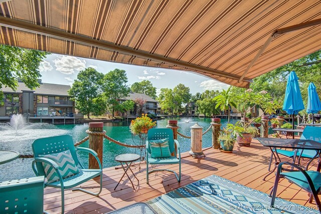 wooden deck featuring a water view