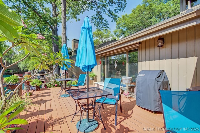 wooden deck with grilling area