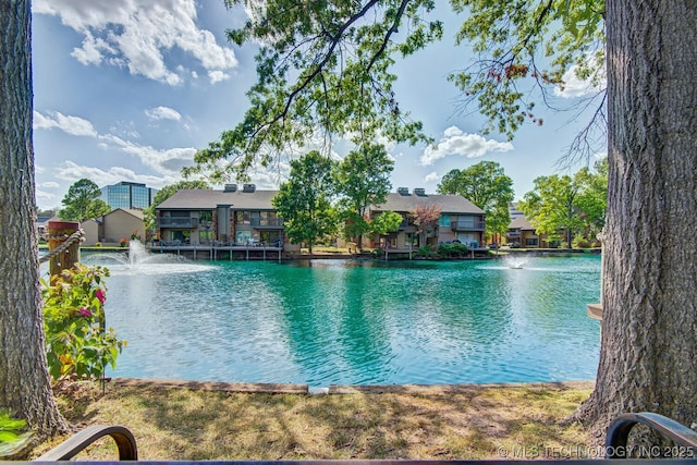 view of swimming pool featuring a water view