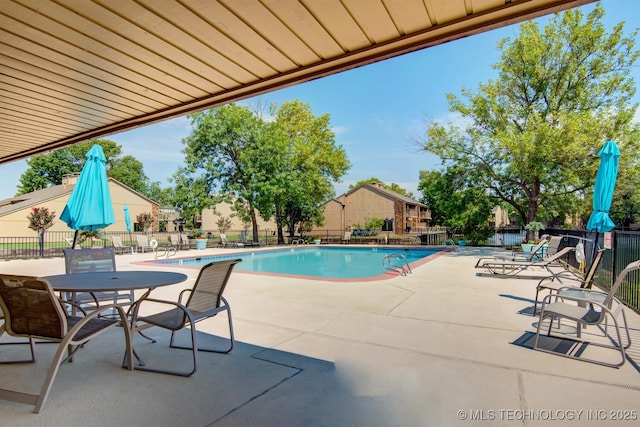 view of swimming pool featuring a patio