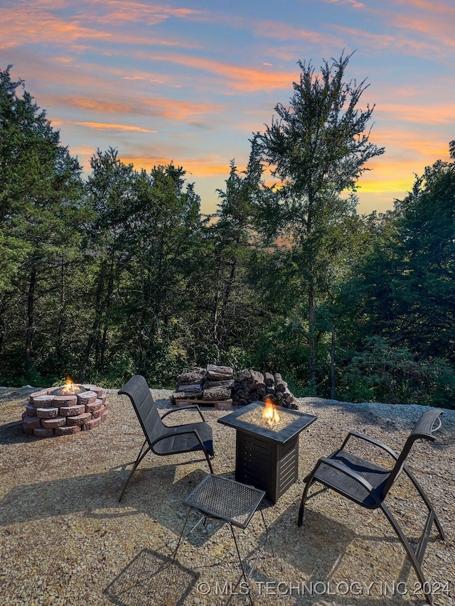 patio terrace at dusk with an outdoor fire pit