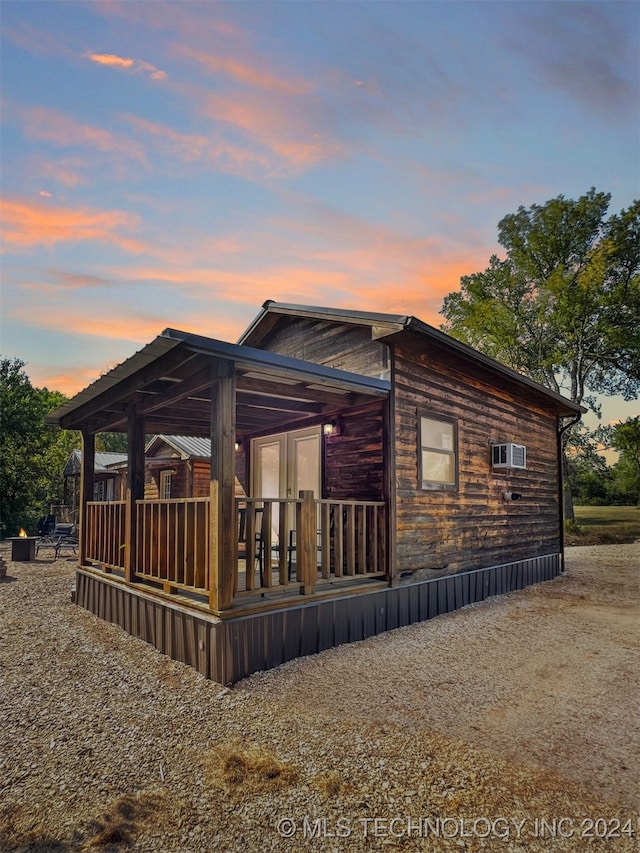 back house at dusk with french doors