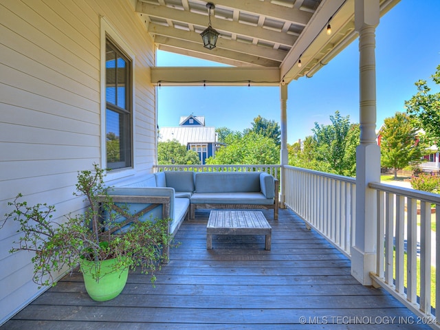 wooden deck featuring outdoor lounge area