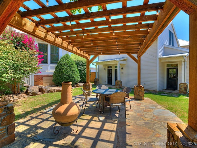 view of patio featuring outdoor dining area and a pergola