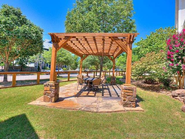 view of patio featuring fence and a pergola