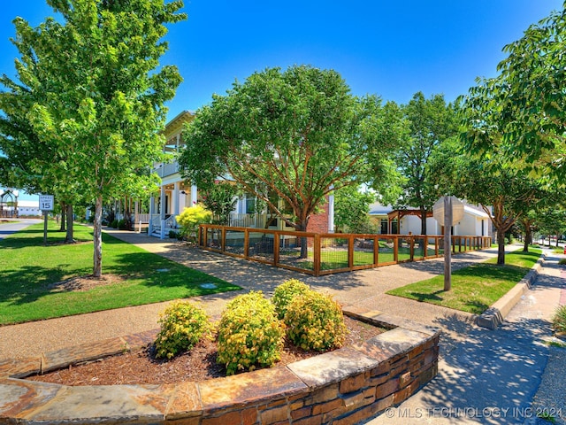 view of home's community featuring a yard