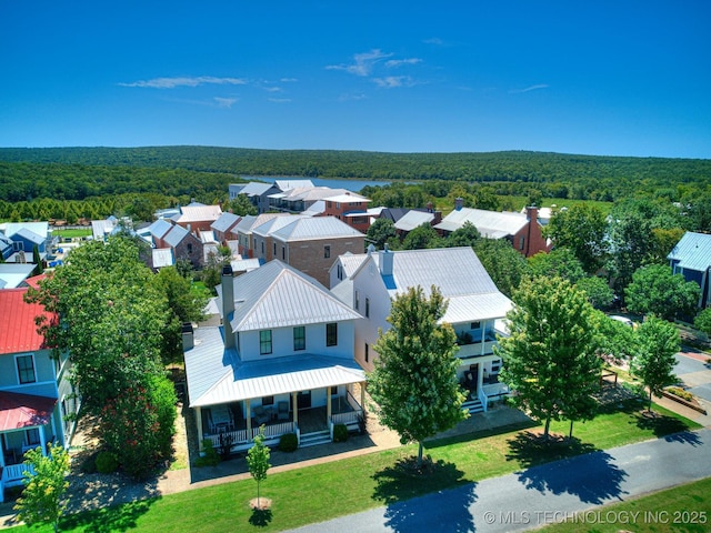 bird's eye view with a residential view and a wooded view