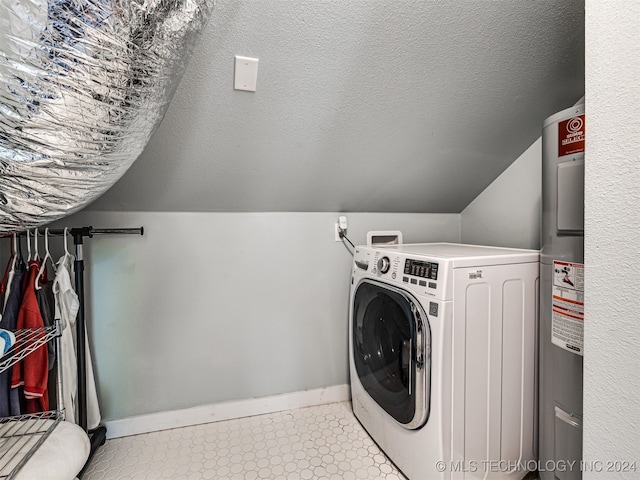 laundry area featuring washer / dryer, water heater, and a textured ceiling