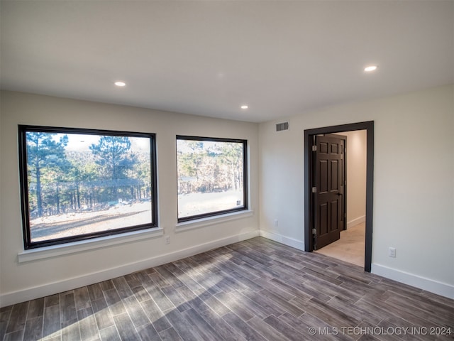 spare room featuring hardwood / wood-style flooring