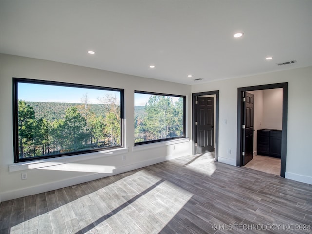 empty room featuring hardwood / wood-style flooring