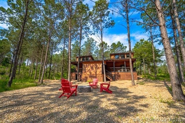 view of jungle gym with a fire pit