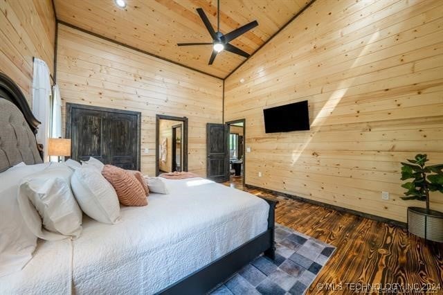 bedroom featuring wood-type flooring, ceiling fan, wooden ceiling, high vaulted ceiling, and wooden walls