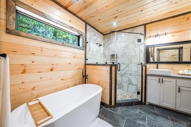 bathroom featuring tile patterned flooring, shower with separate bathtub, vanity, and wooden ceiling