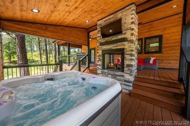 deck featuring a hot tub