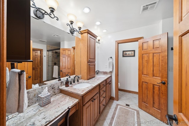 bathroom with vanity, toilet, tile patterned floors, and a shower with shower door