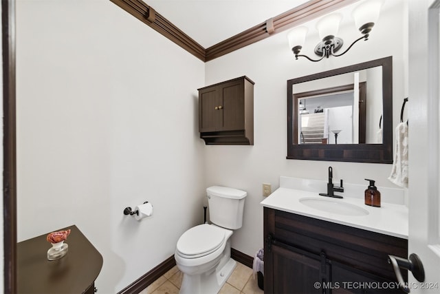 bathroom with vanity, tile patterned flooring, ornamental molding, and toilet