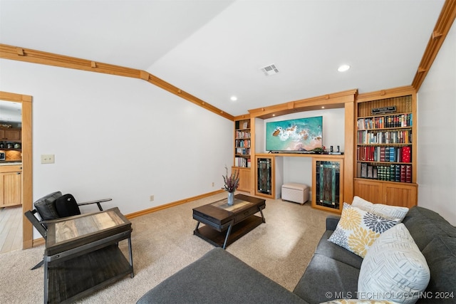 living room featuring crown molding, vaulted ceiling, built in features, and carpet flooring