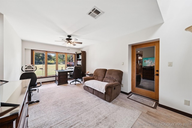 office area with light hardwood / wood-style flooring and ceiling fan