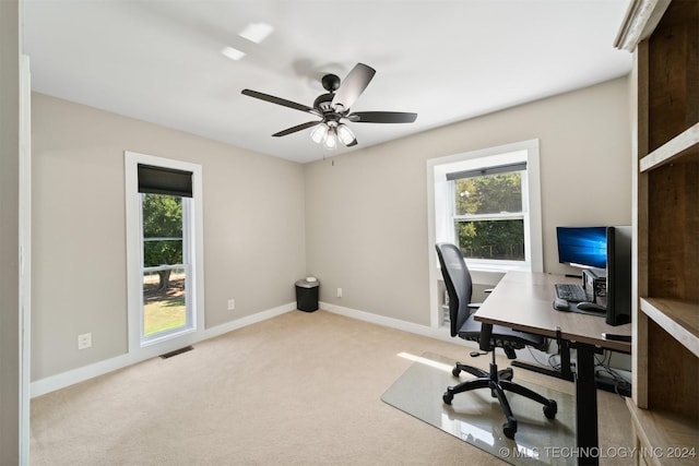 carpeted office with ceiling fan