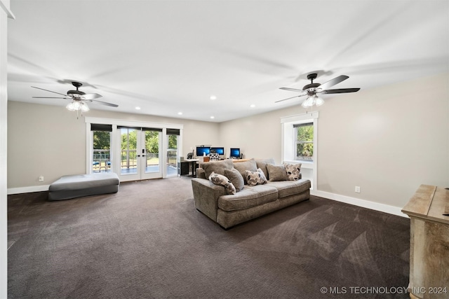 living room featuring dark colored carpet, ceiling fan, and french doors