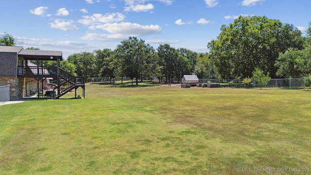 view of yard featuring a wooden deck