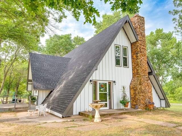 back of property with a patio area