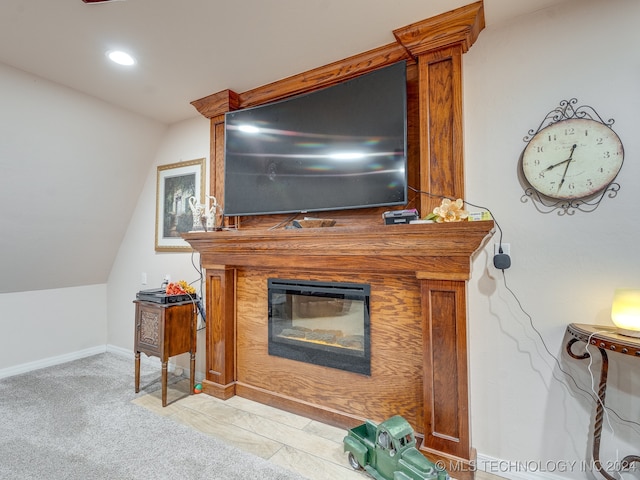 carpeted living room featuring vaulted ceiling