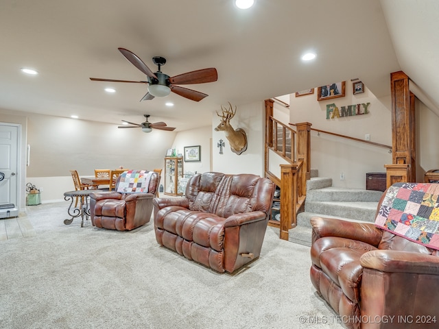 carpeted living room featuring ceiling fan