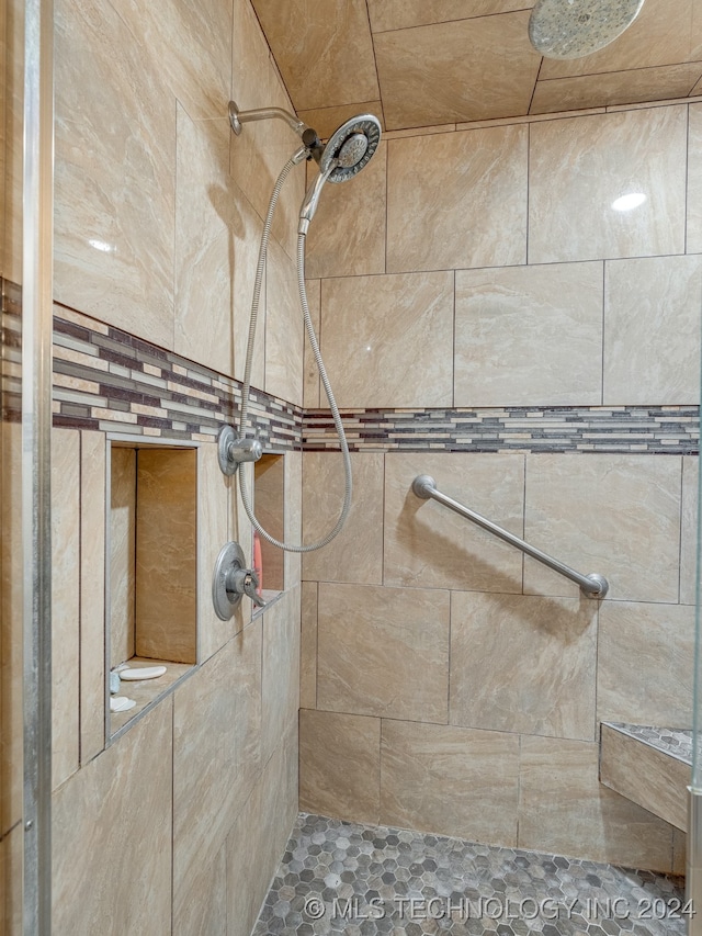 bathroom with tiled shower