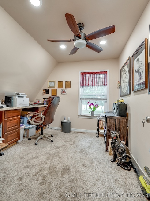 office area featuring carpet flooring, lofted ceiling, and ceiling fan