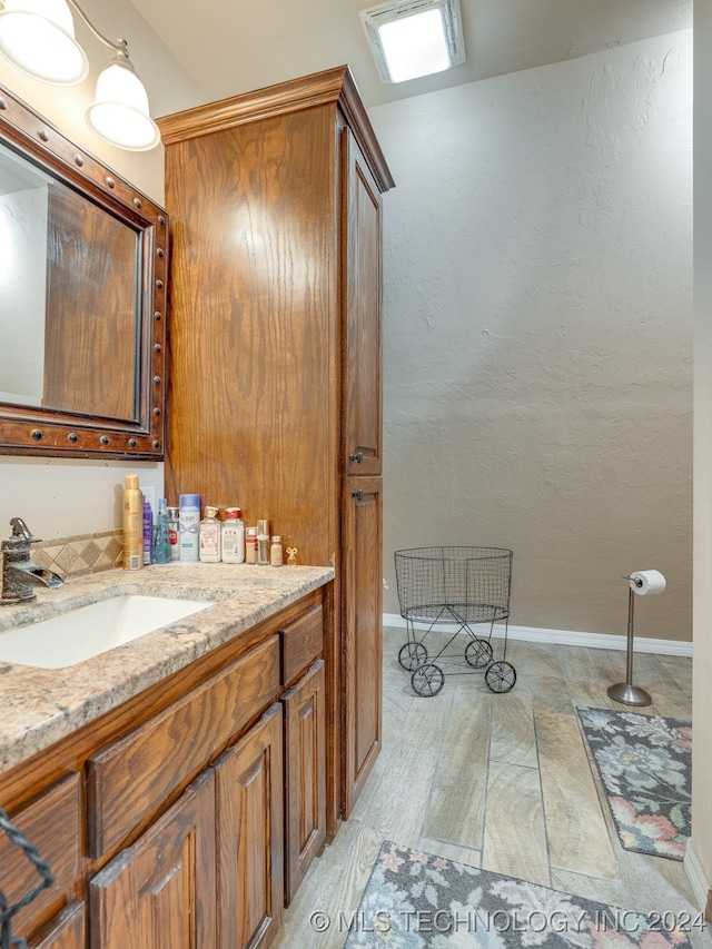 bathroom featuring tile patterned flooring and vanity