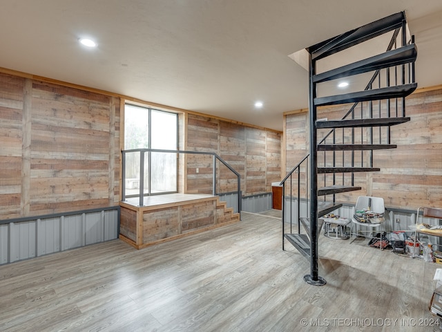 interior space with wooden walls and wood-type flooring