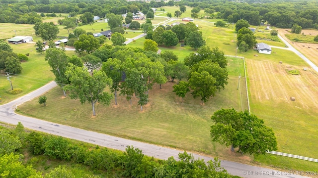 birds eye view of property featuring a rural view